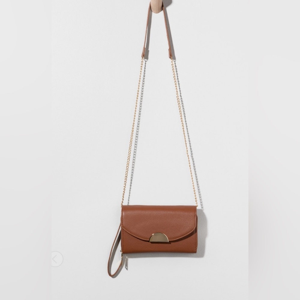 Brown wristlet with gold crossbody straps